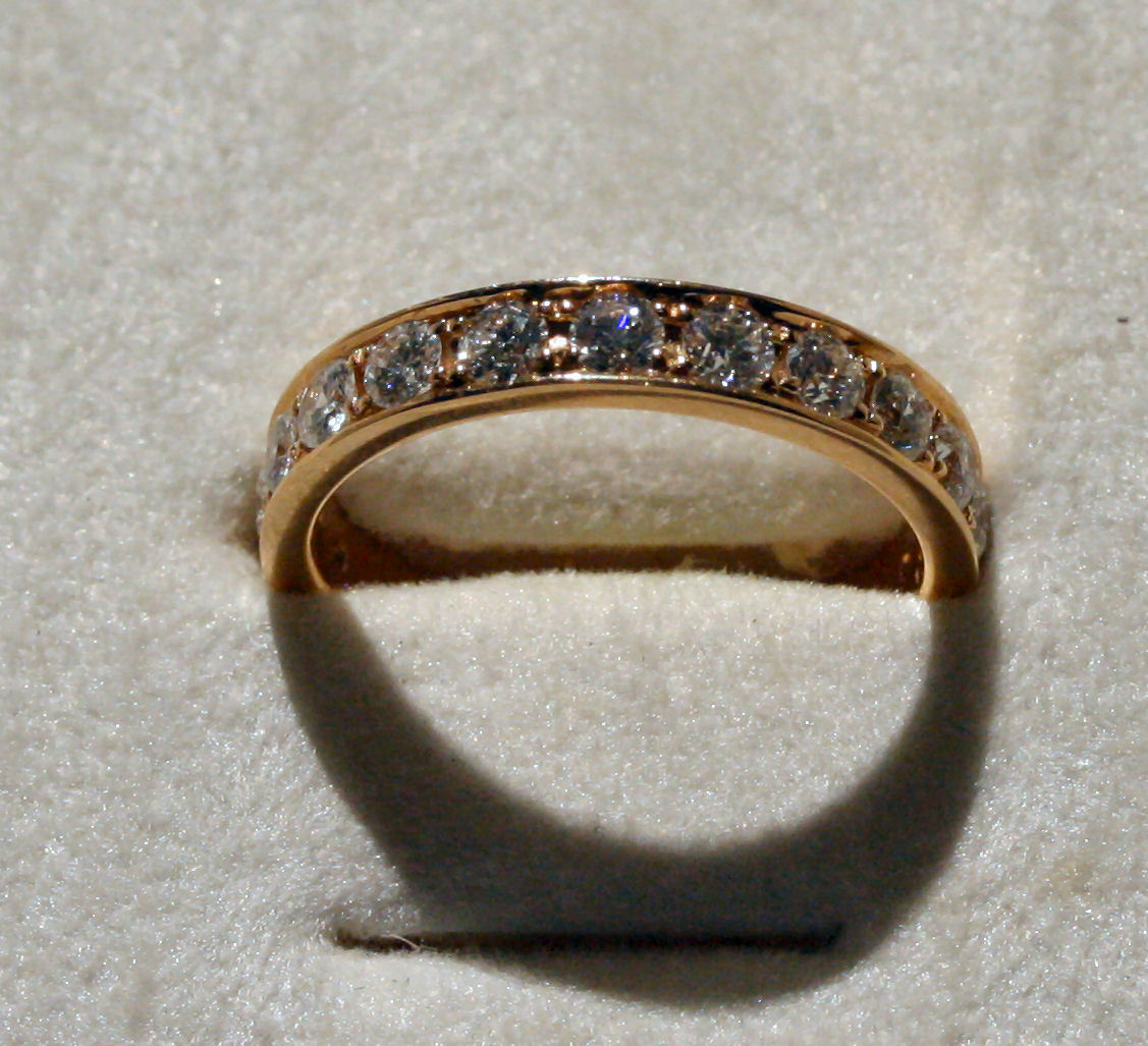 An 18ct rose gold diamond set full eternity ring