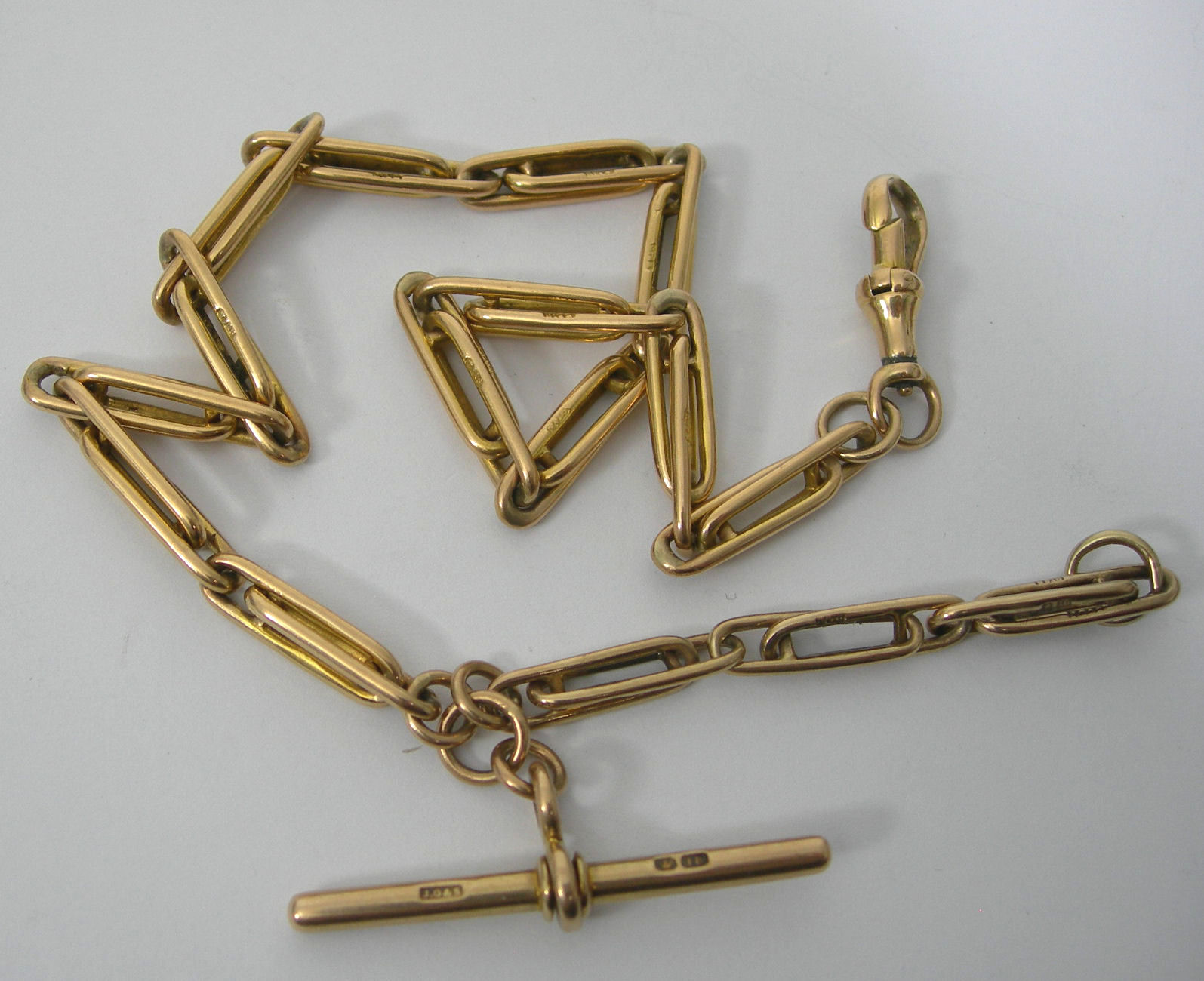An 18ct gold fancy link Albert chain,