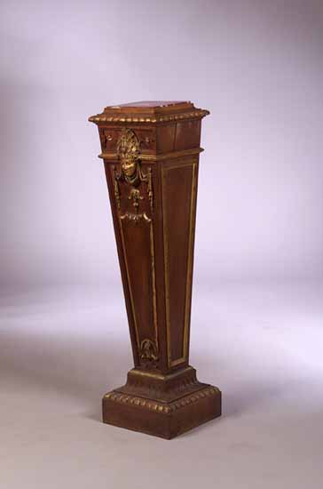 A walnut pedestal
