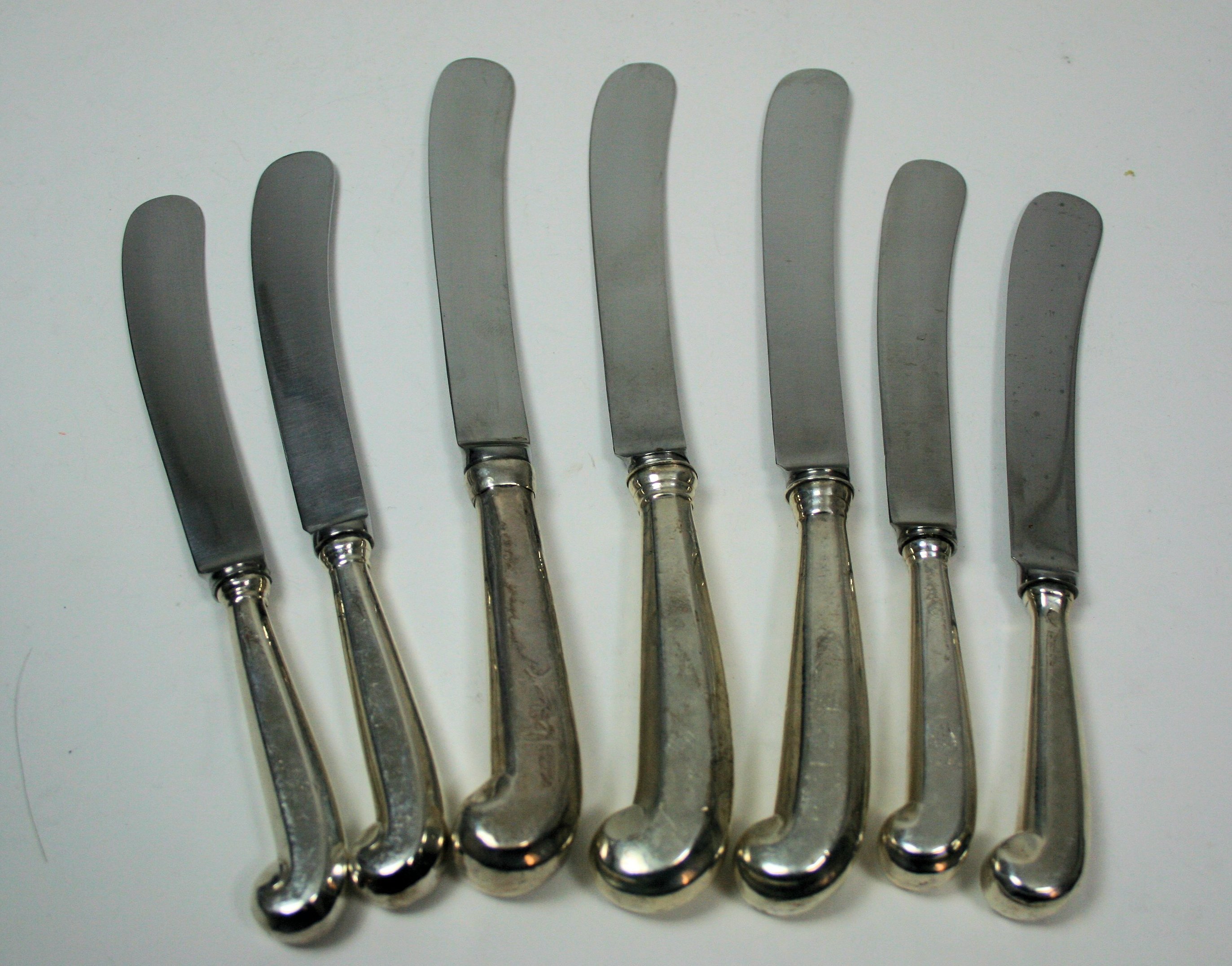 A set of 18th century silver mounted pistol grip knives