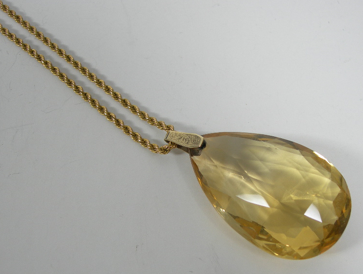 A large briolette cut citrine pendant,