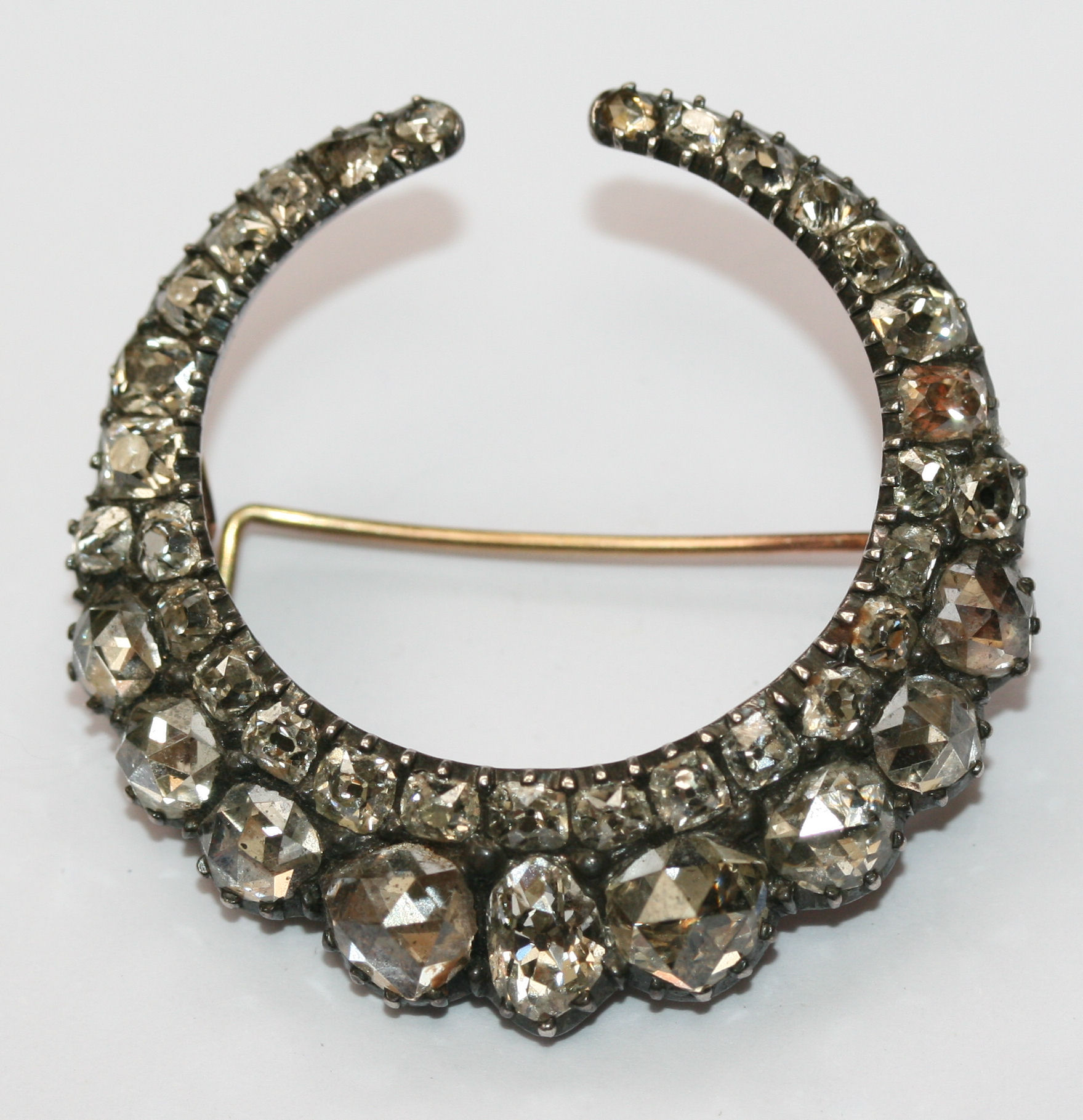 A mid 19th century diamond crescent brooch