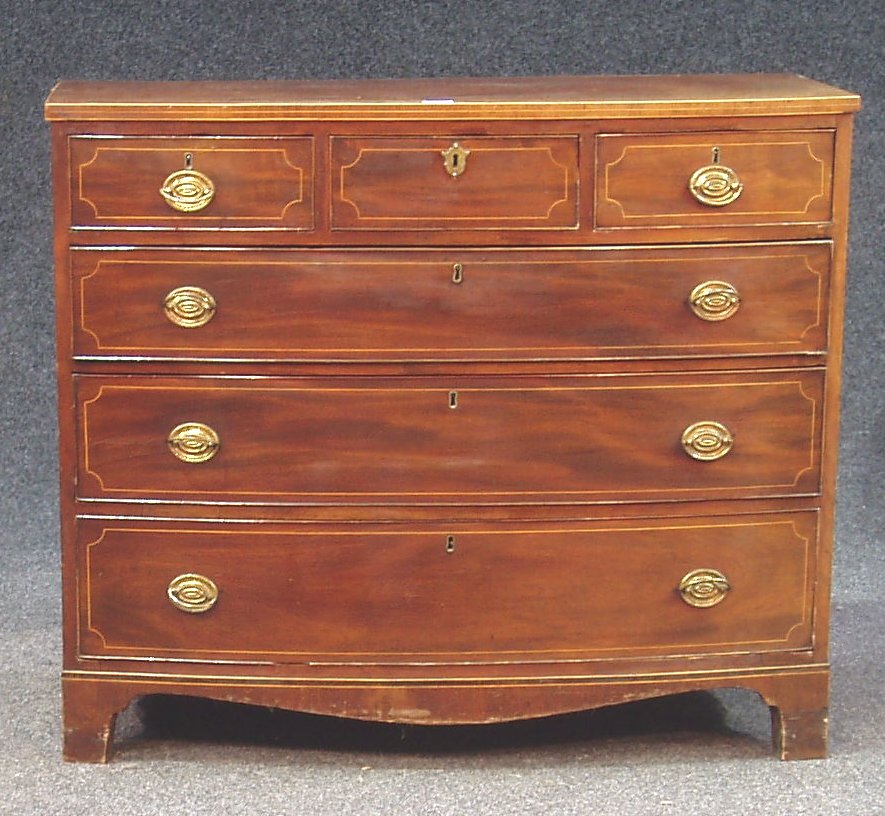A mahogany and line inlaid bow front chest,