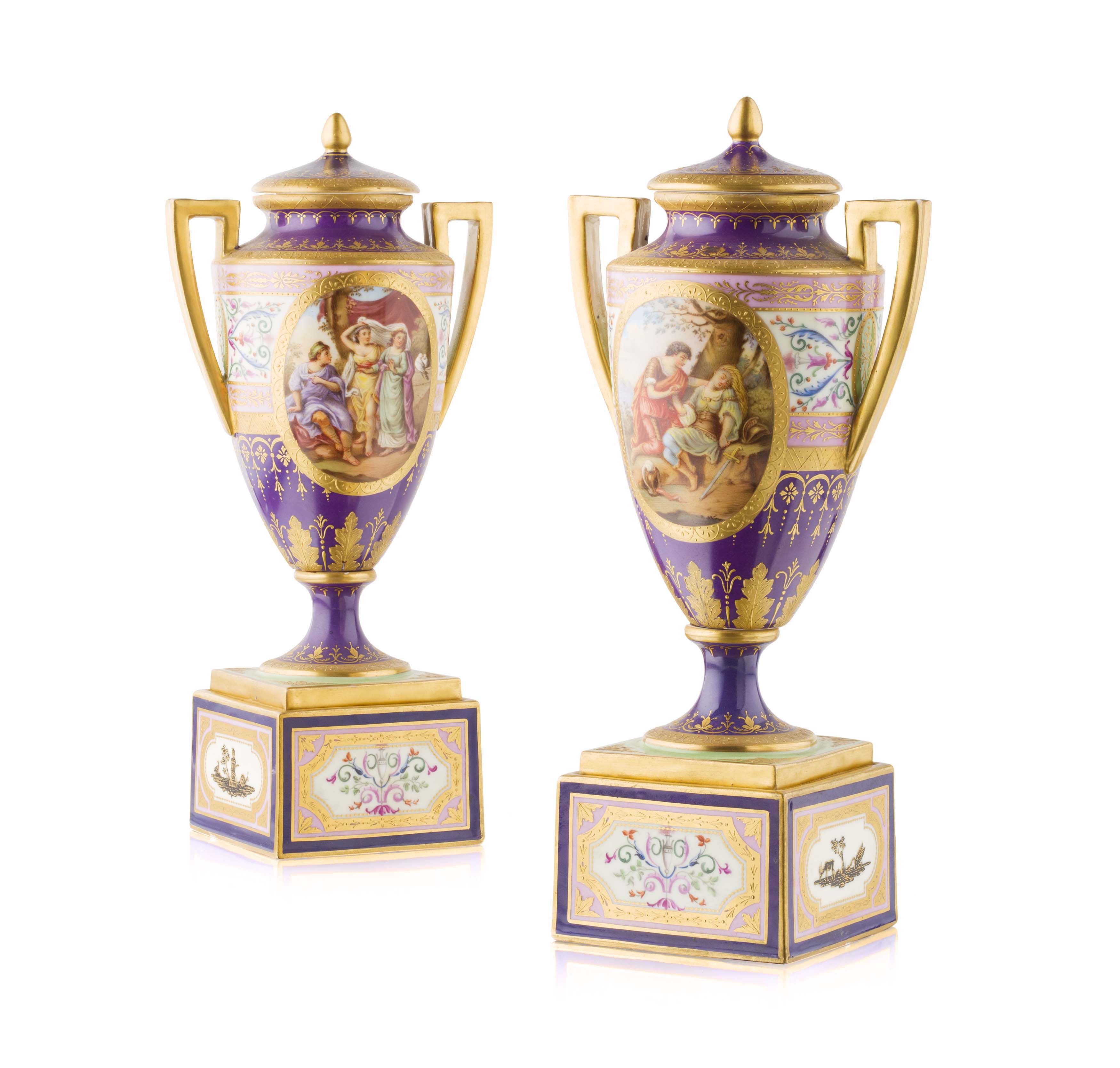 PAIR OF VIENNA PORCELAIN COVERED URNS ON STANDS
