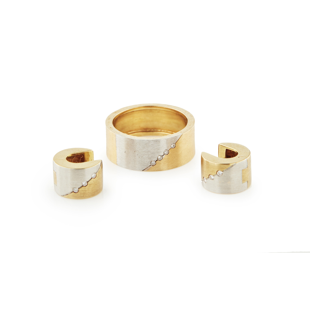 A contemporary diamond set ring and matching earrings