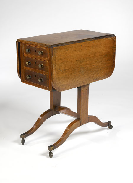 An unusual Regency period mahogany and satinwood crossbanded Pembroke table