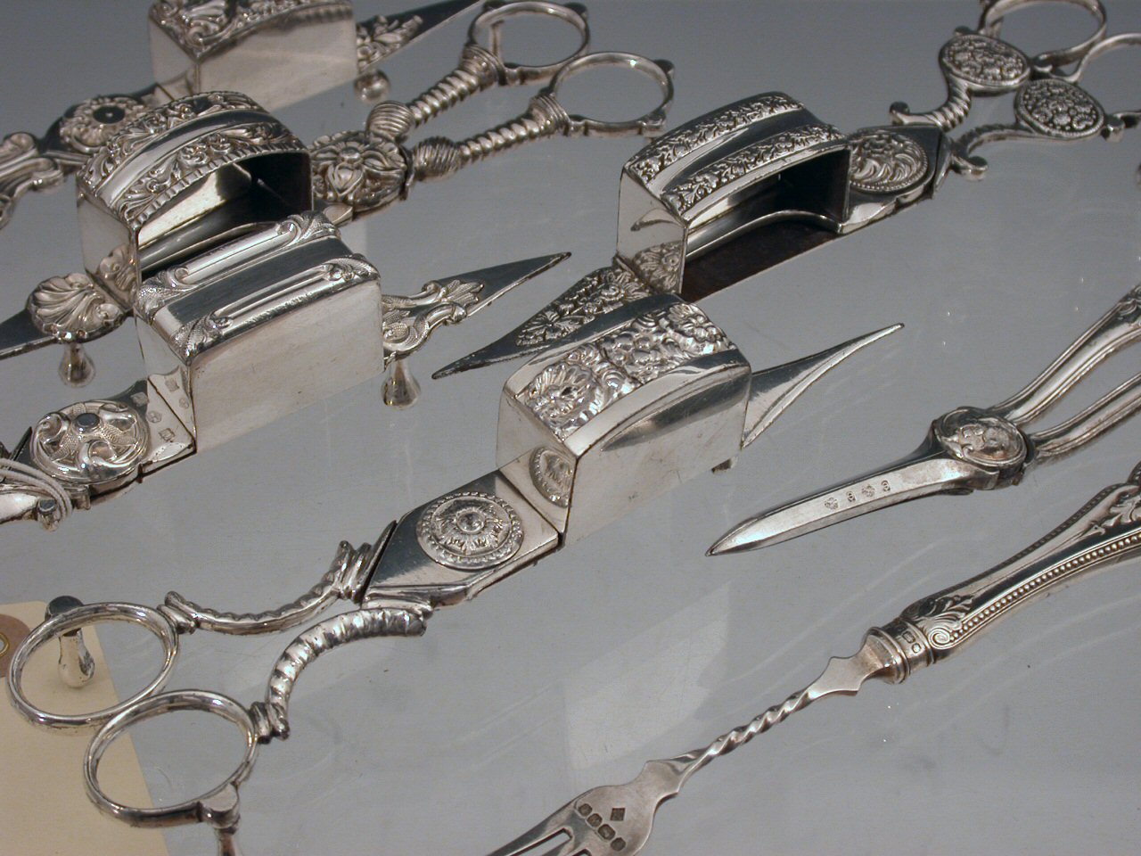 A group of five various 19th century and Sheffield plated candle snips