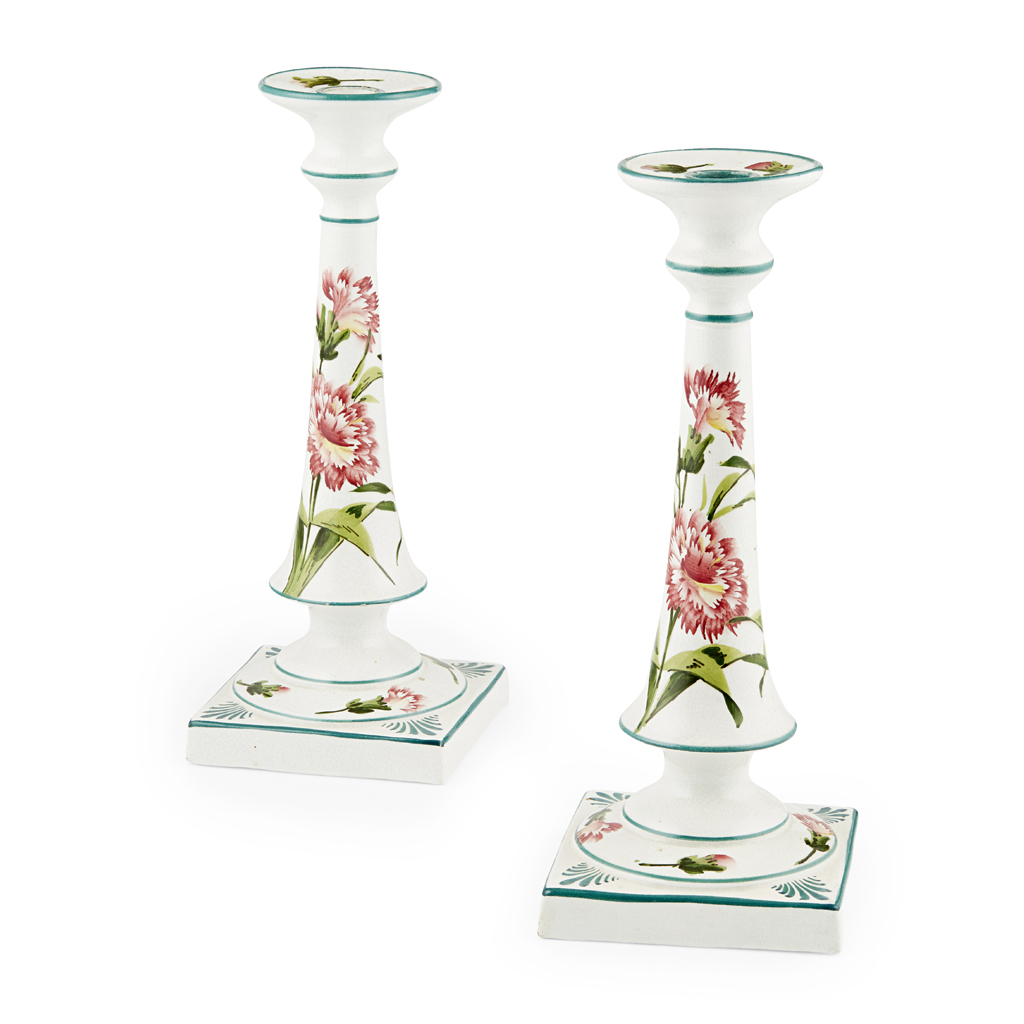 A NEAR PAIR OF WEMYSS WARE TALL CANDLESTICKS