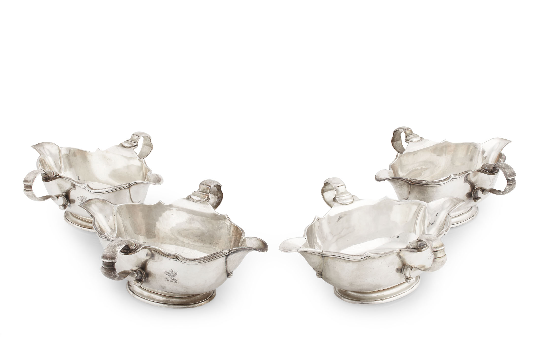 A matched set of four double lipped sauce boats