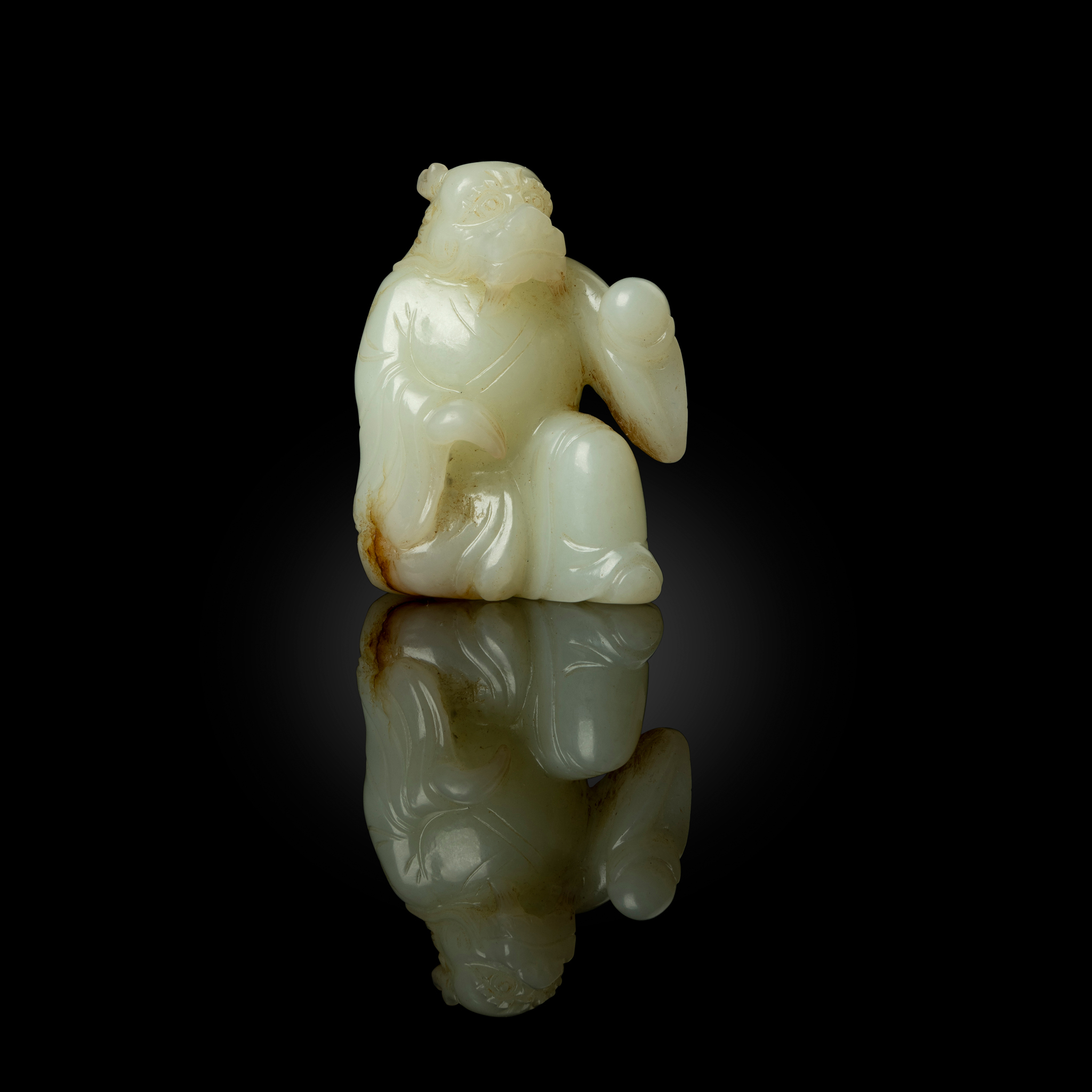 CHINESE WHITE JADE CARVING OF A DRAGON-HEADED DEITY