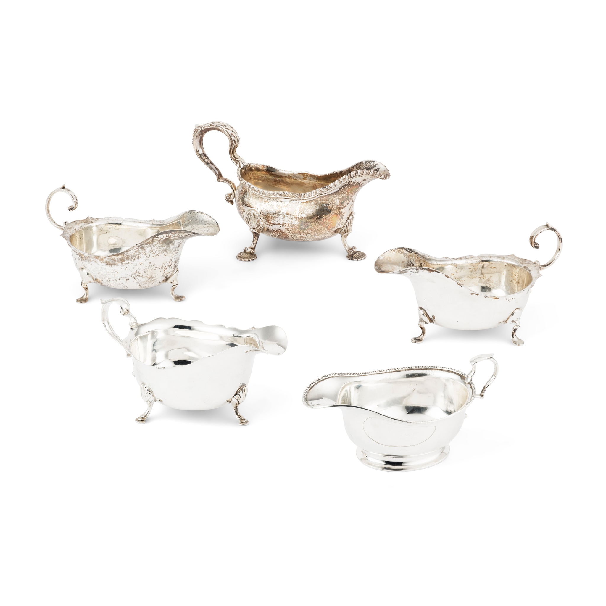 A collection of five sauceboats