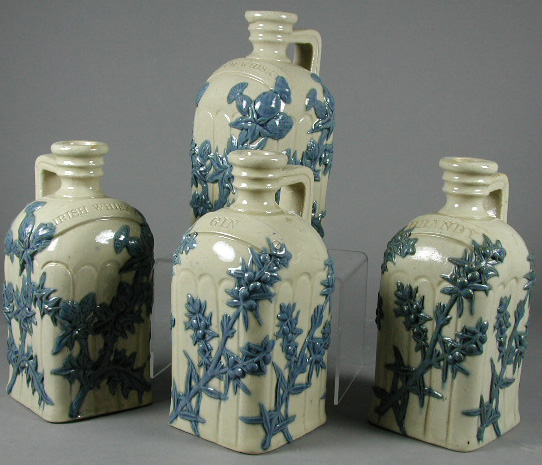 Four Doulton Lambeth 'basket' decanters