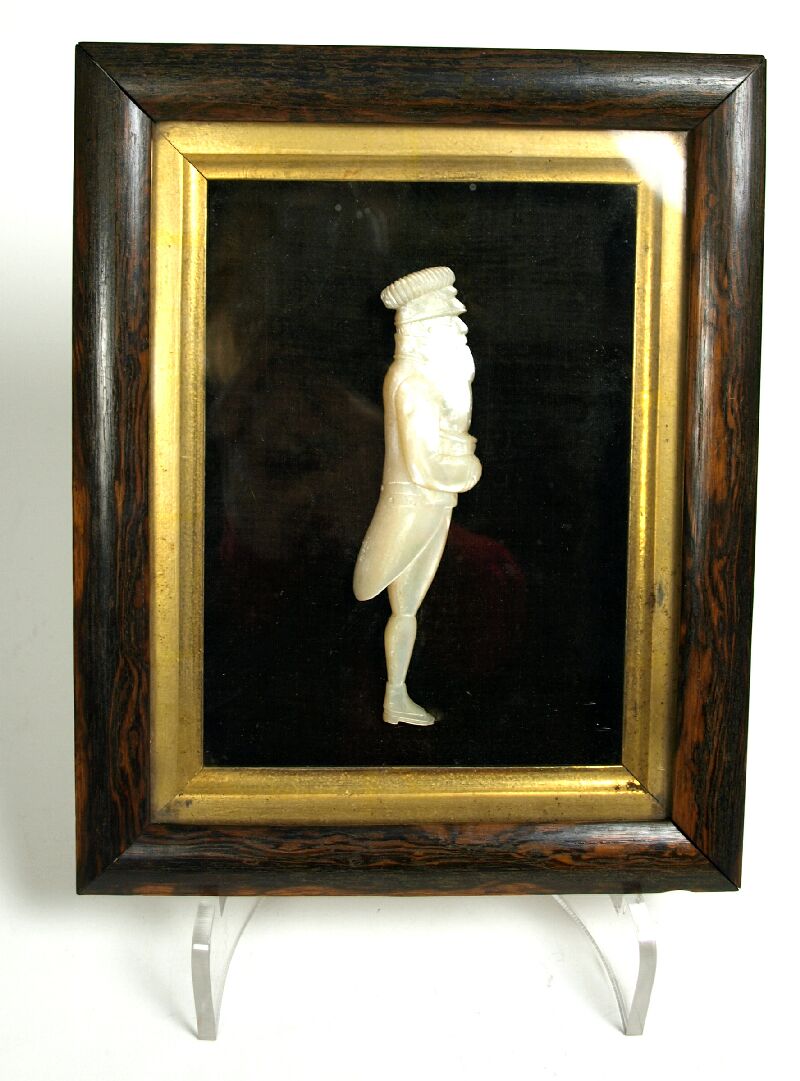 A 19th century relief carved mother of pearl figure of a bearded sailor