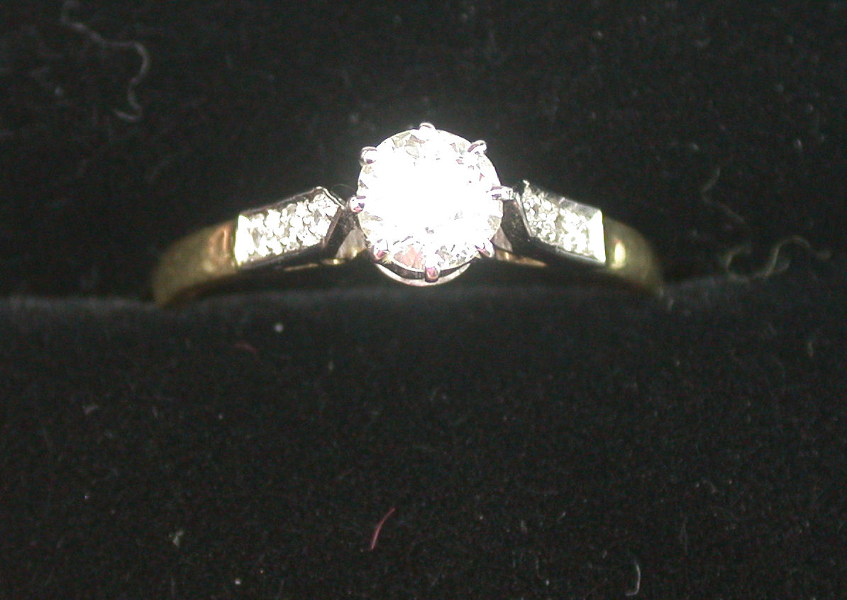 An 18ct gold mounted diamond ring,