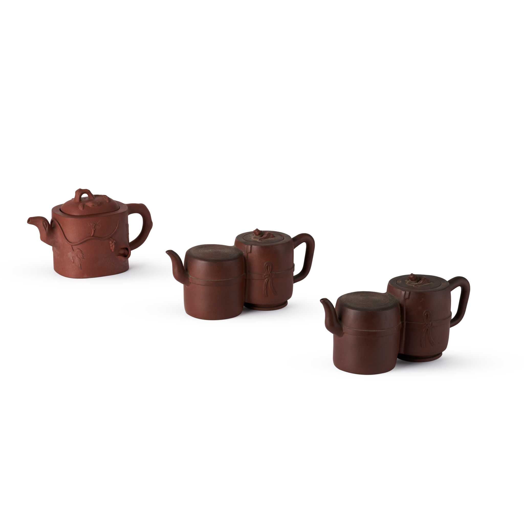 GROUP OF THREE YIXING STONEWARE TEAPOTS