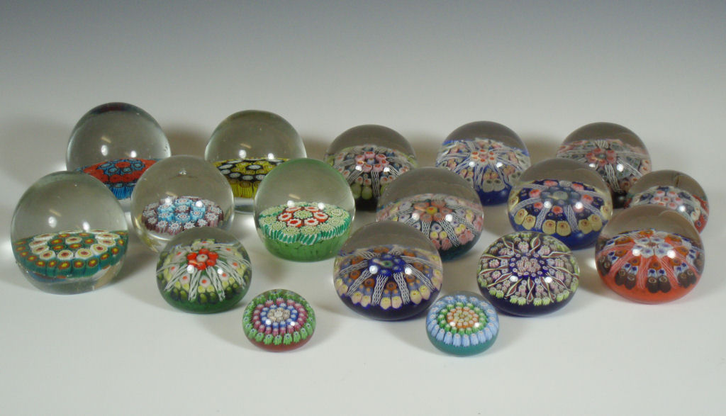 A collection of modern Scottish and Murano glass paperweights