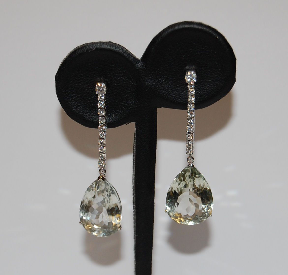 A pair of diamond and pale green quartz pendant earrings