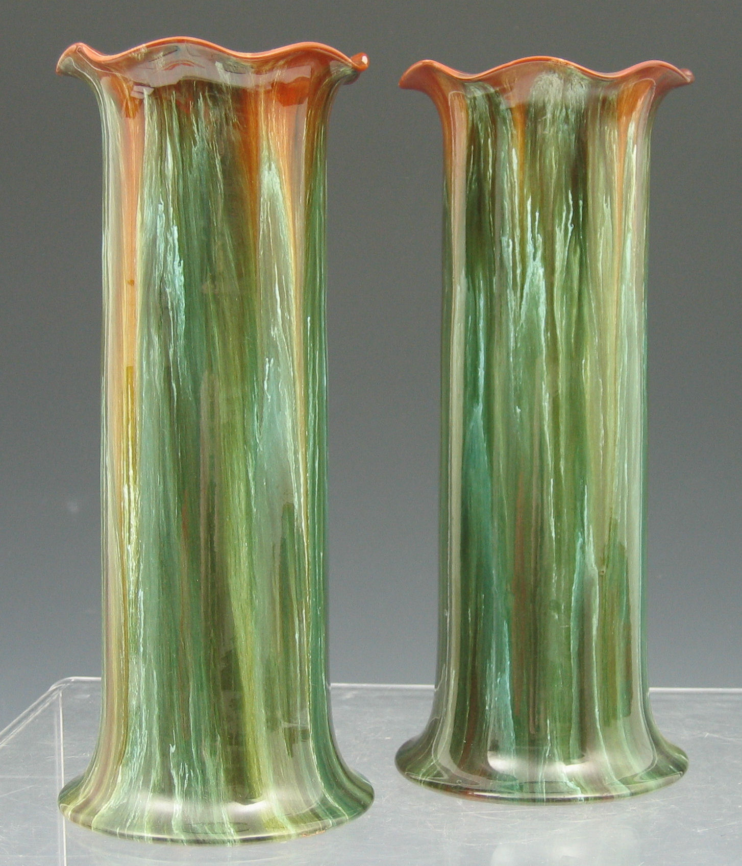 A pair of Linthorpe cylindrical spill vases,