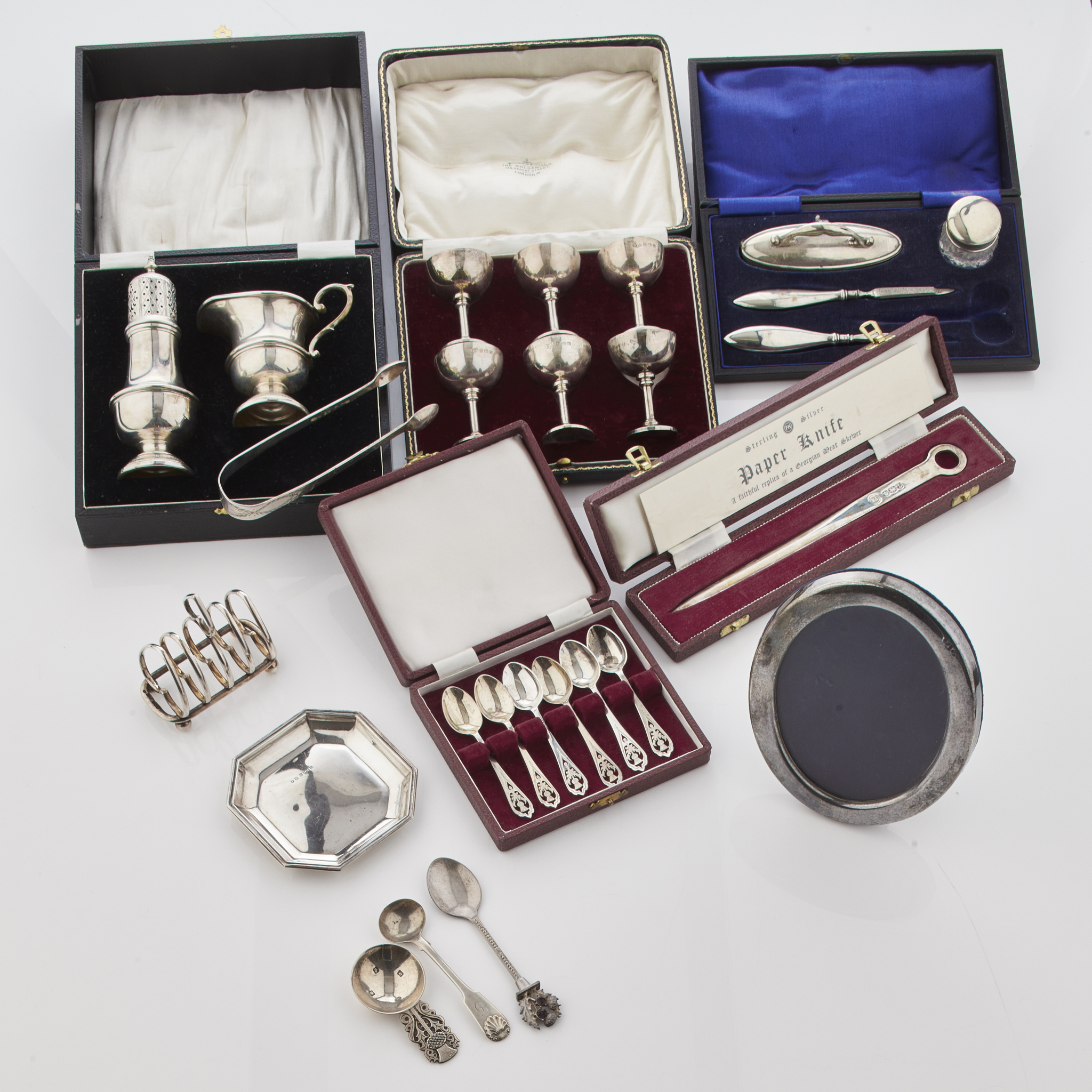 A collection of cased silver