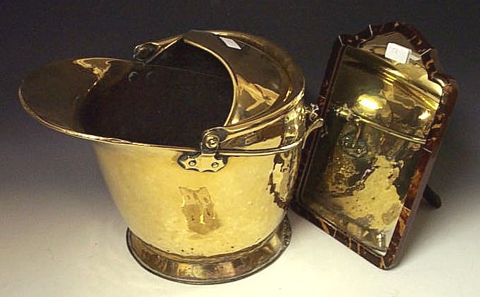 A brass helmet shaped coal scuttle;