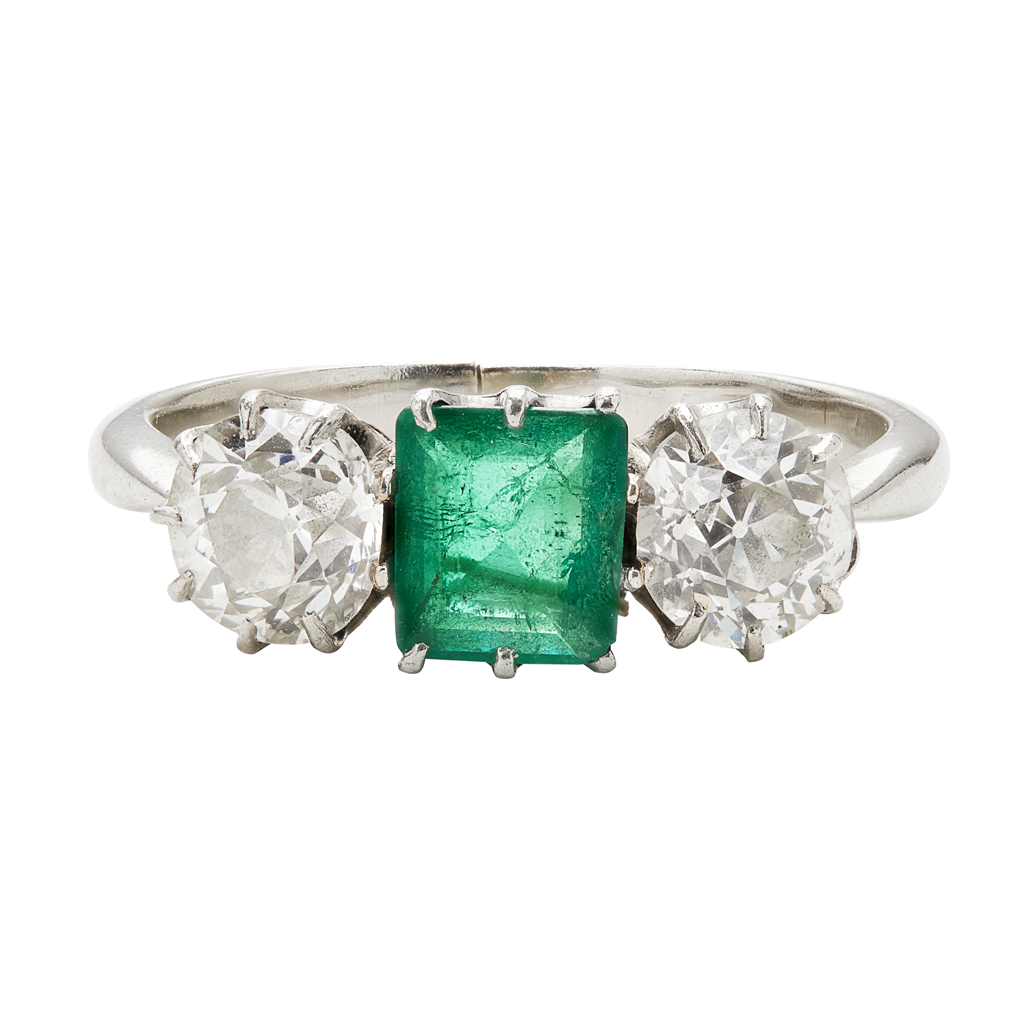 An emerald and diamond set ring