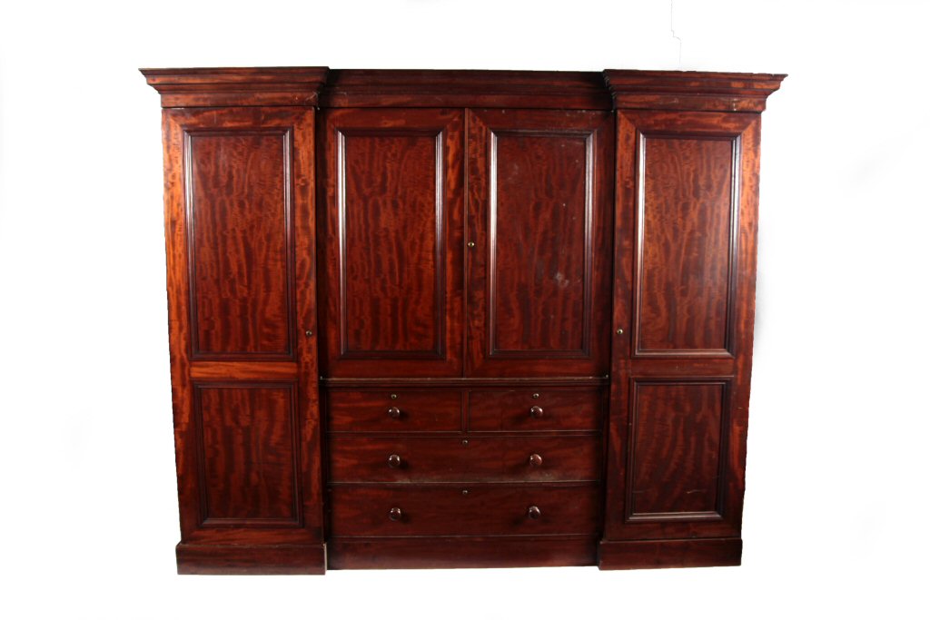 A 19th century mahogany inverted breakfront wardrobe