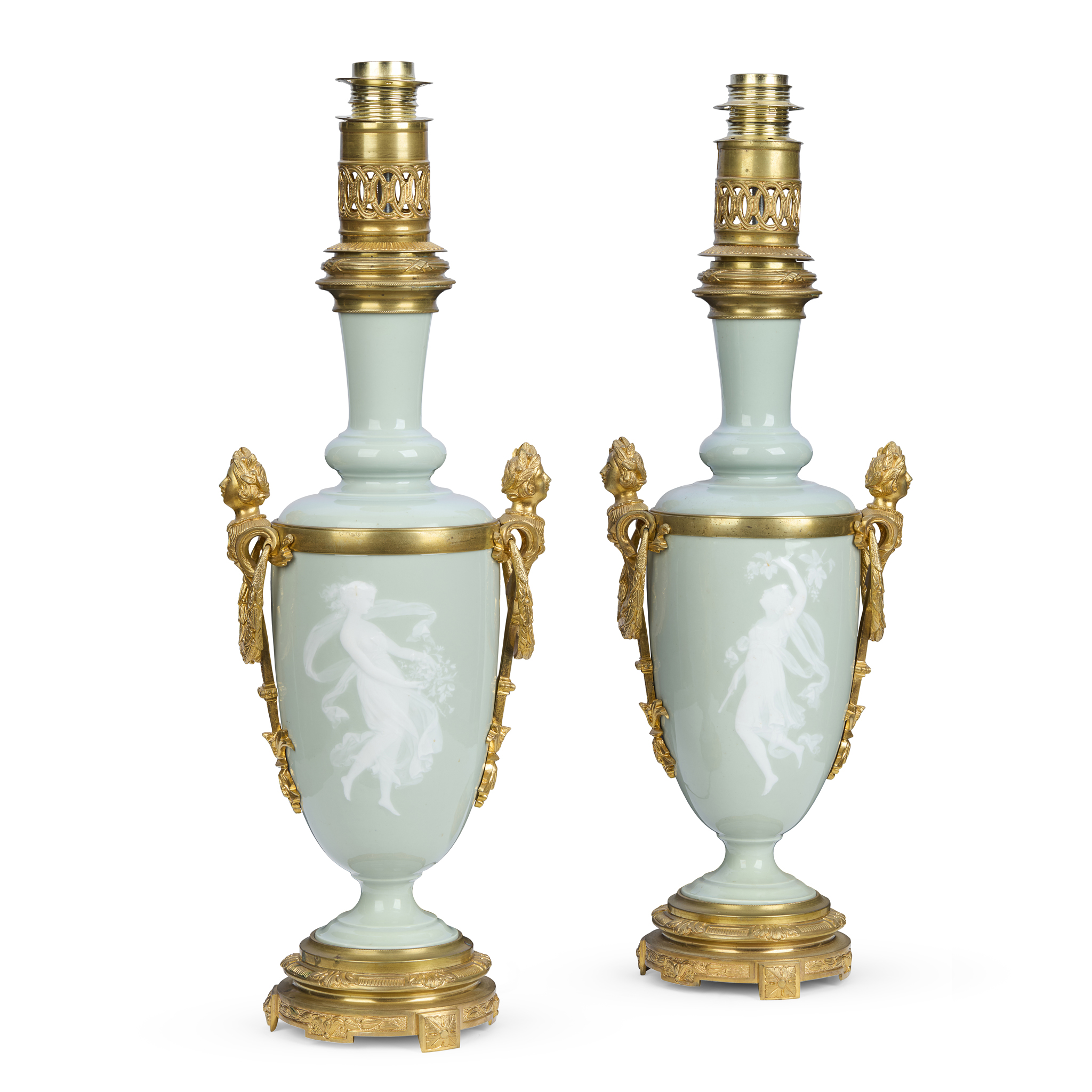 A PAIR OF CELADON GLAZED PÂTE-SUR-PÂTE VASES, MOUNTED AS LAMPS
