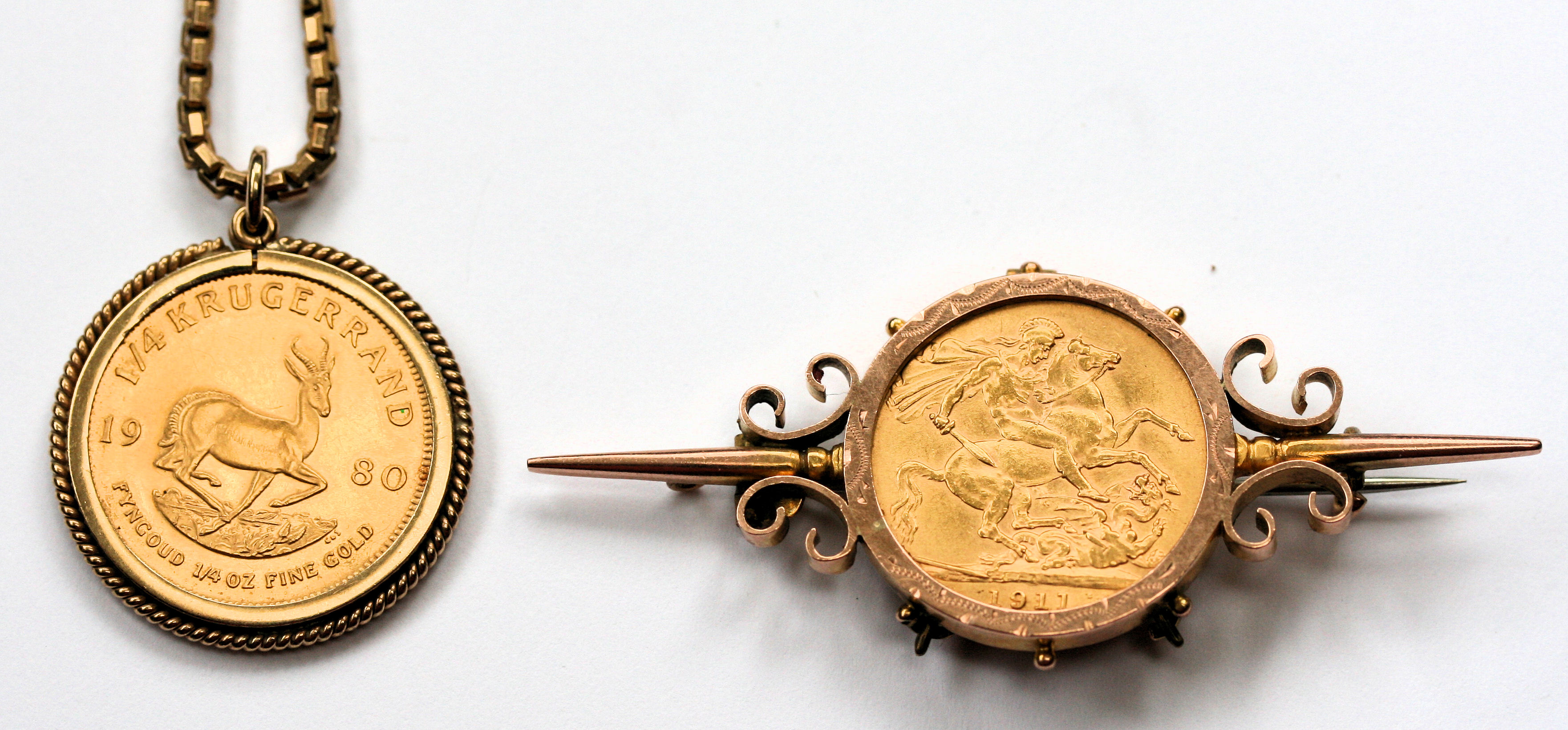 A gold bar brooch with a sovereign