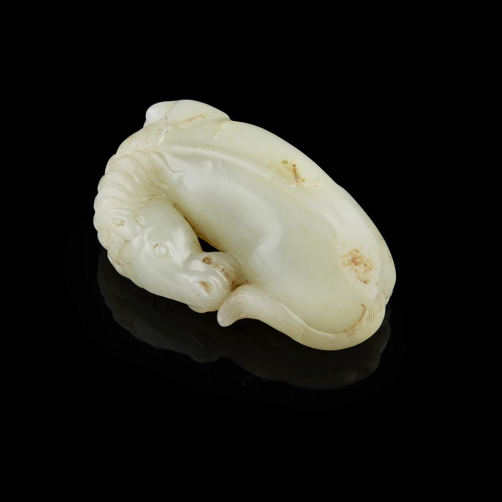 CELADON JADE CARVING OF A RECUMBENT HORSE