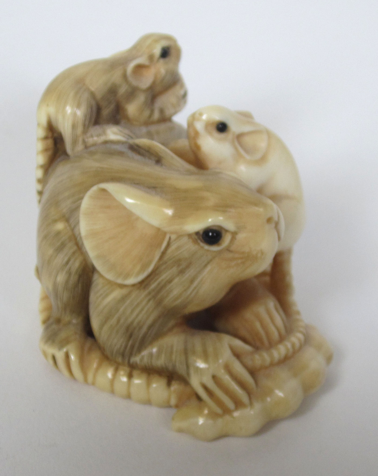TWO JAPANESE CARVED IVORY NETSUKES