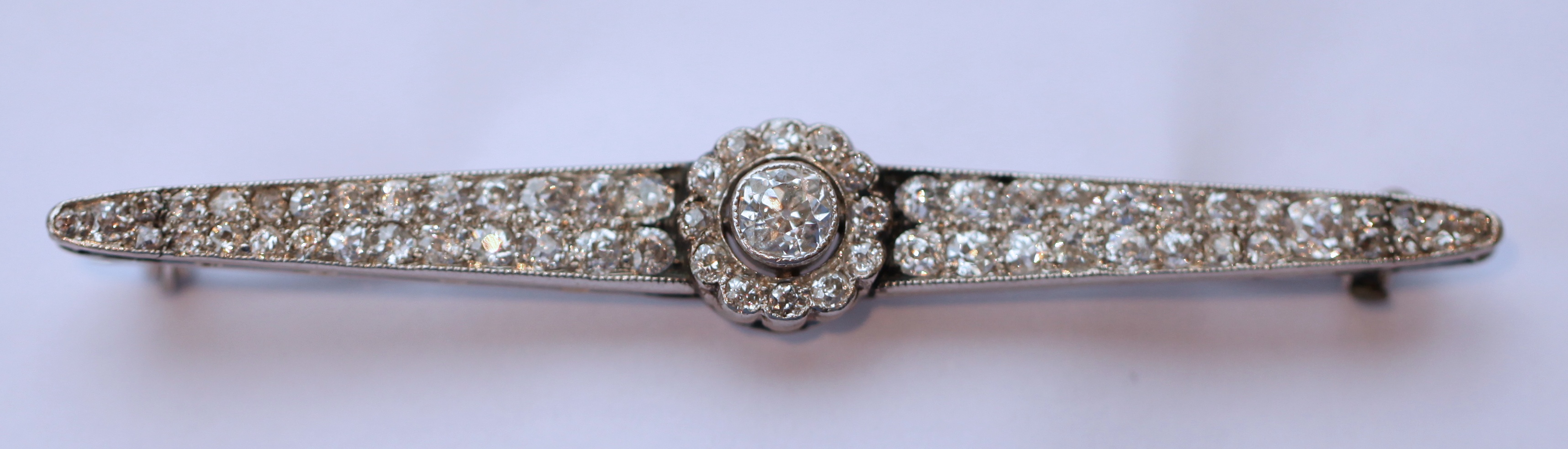 A diamond set bar brooch