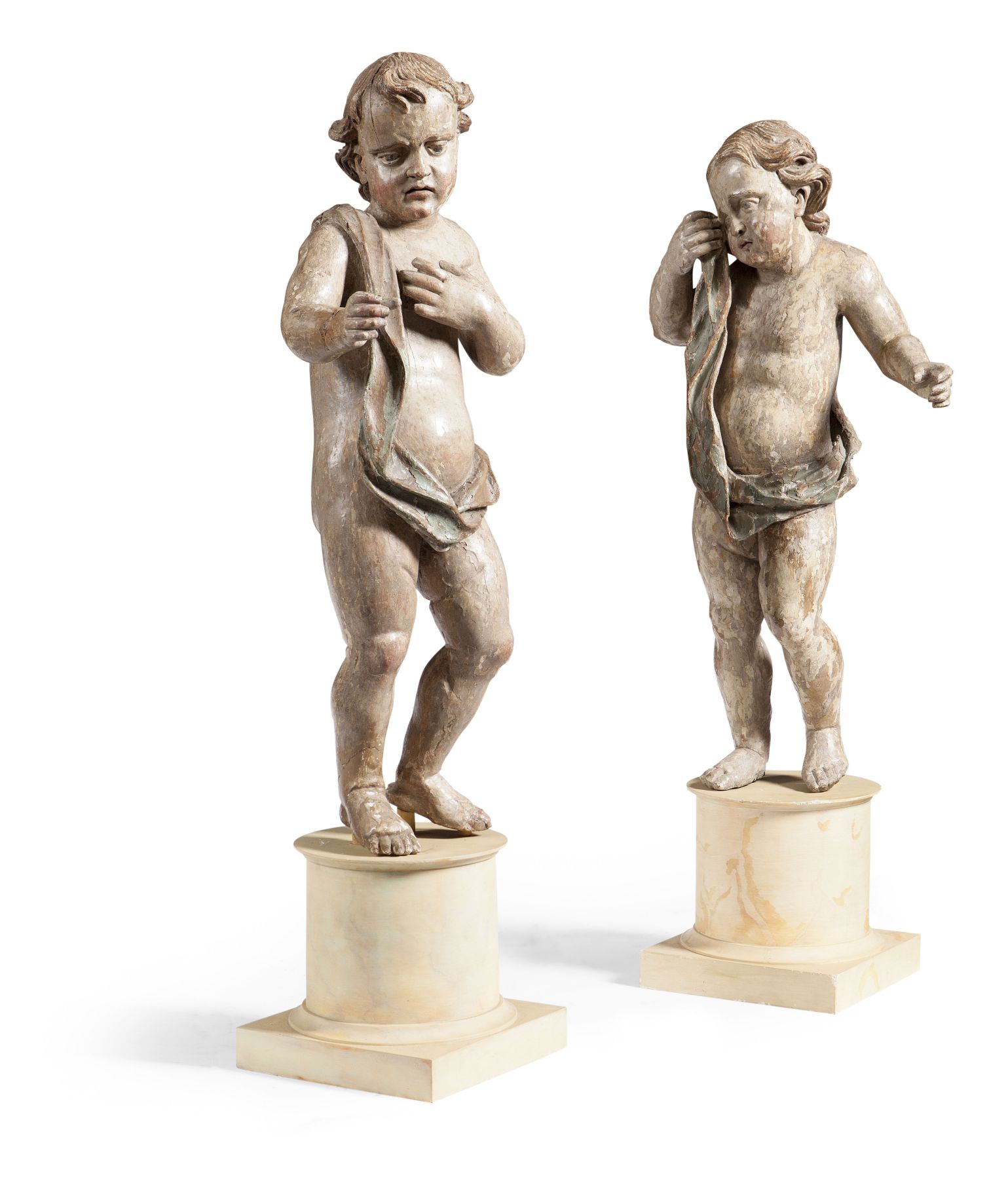 PAIR OF CONTINENTAL CARVED AND POLYCHROMED PUTTI
