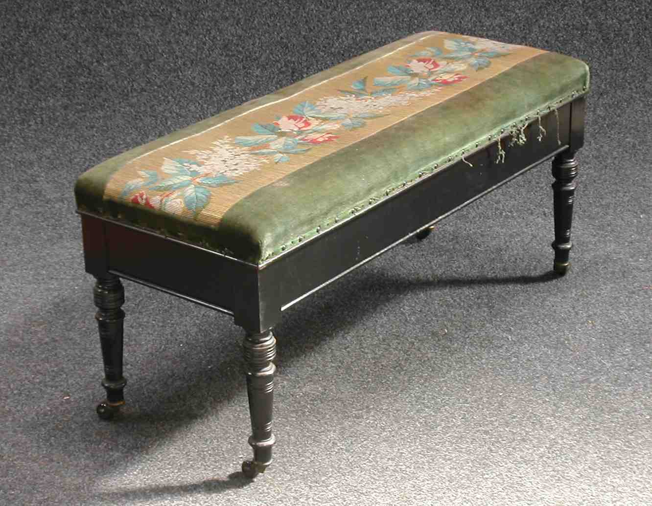 A Victorian ebonised duet stool,