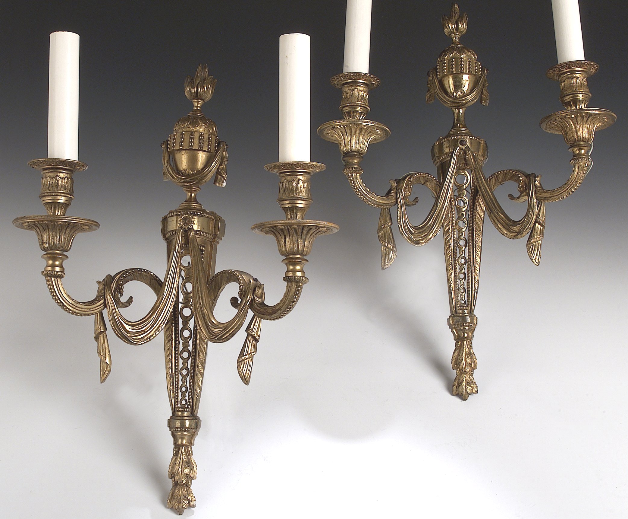 A set of four ormolu wall sconces