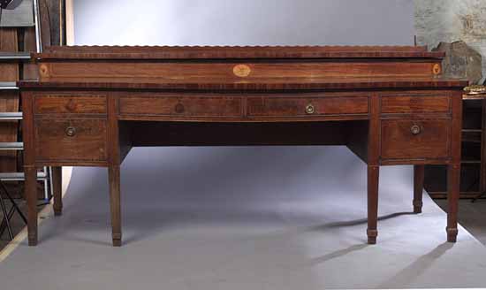 A large George III Scottish mahogany serpentine sideboard