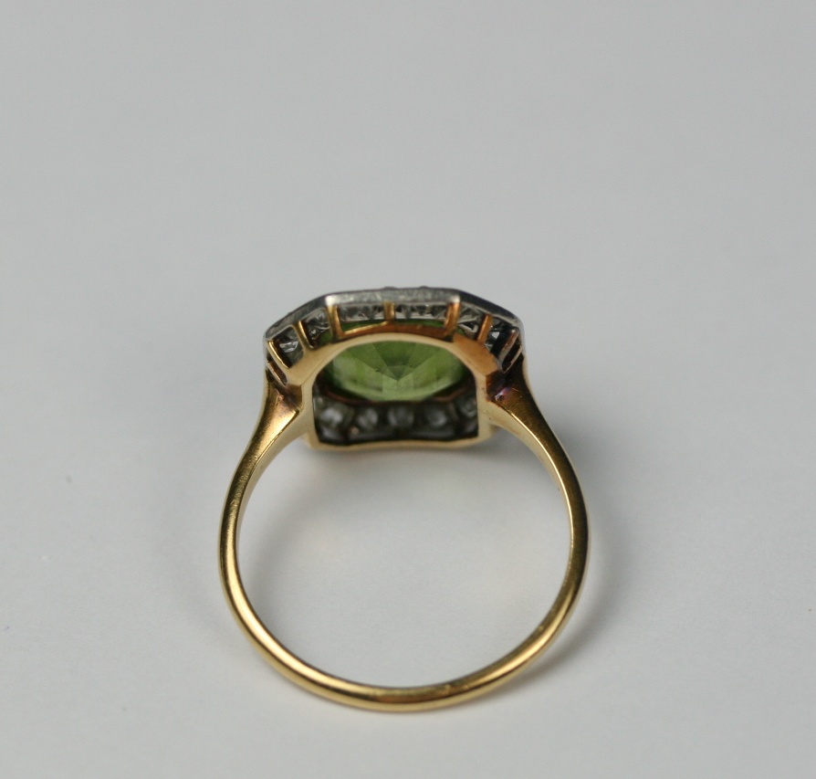 A peridot and diamond set ring