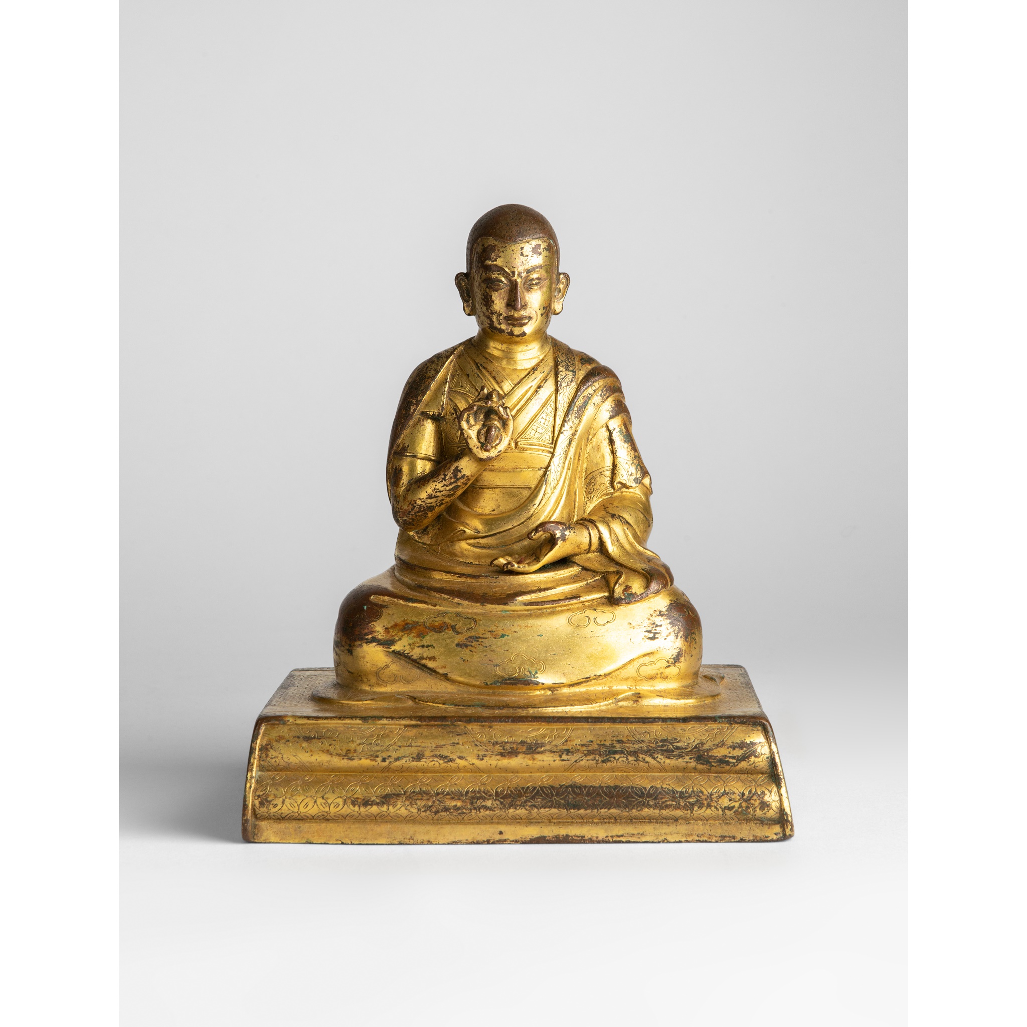 GILT BRONZE SEATED FIGURE OF A LAMA