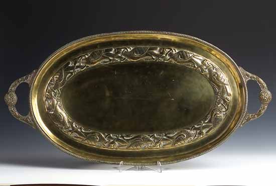 An oval twin-handle brass tray