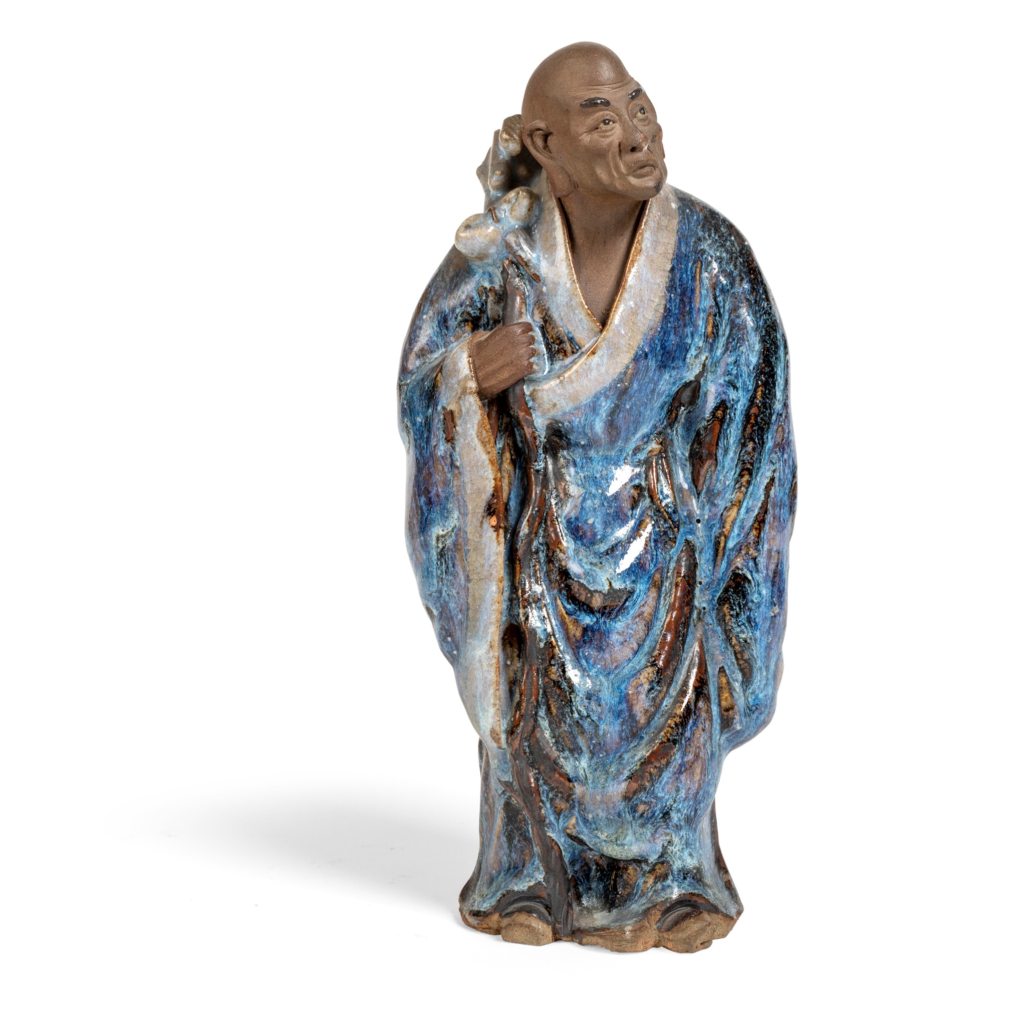 FLAMBE-GLAZED SHIWAN POTTERY FIGURE OF A MONK