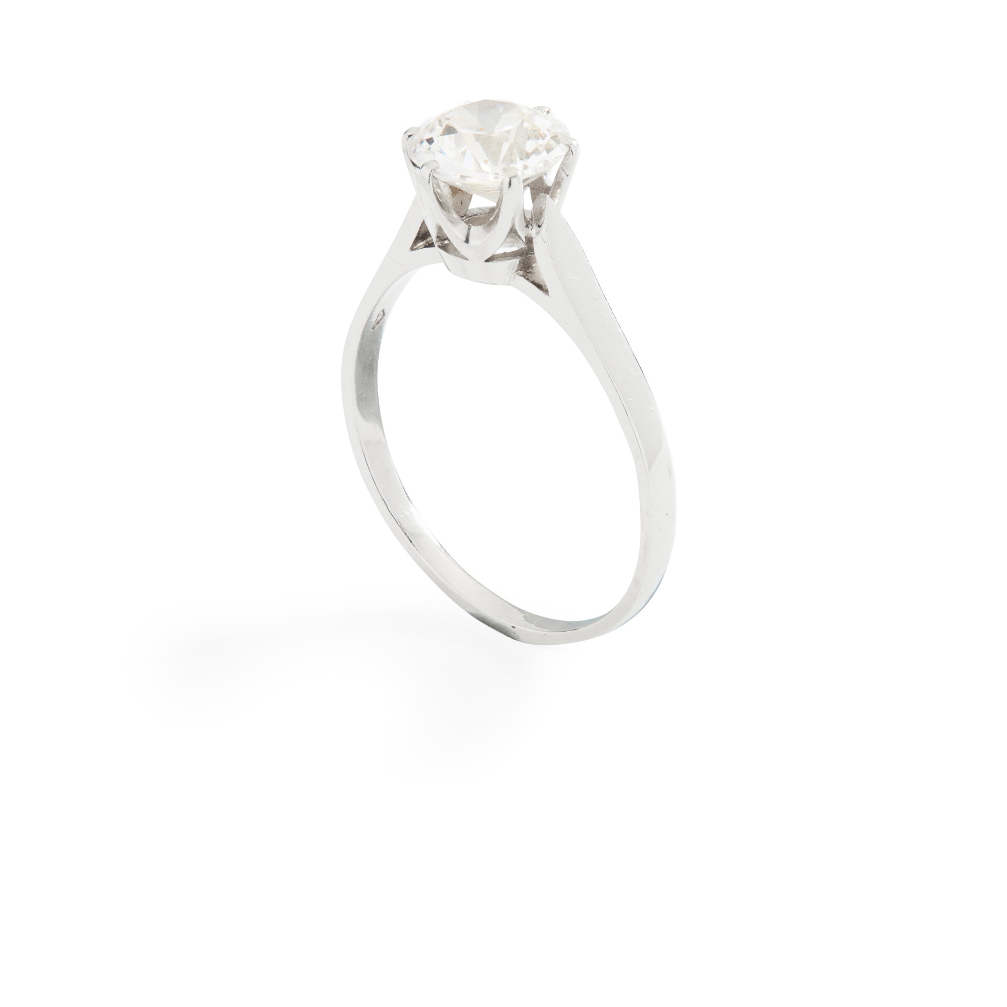 A single-stone diamond ring on plain band