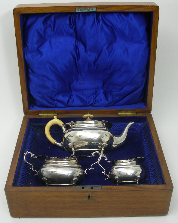 A CASED THREE PIECE EDWARDIAN TEASET