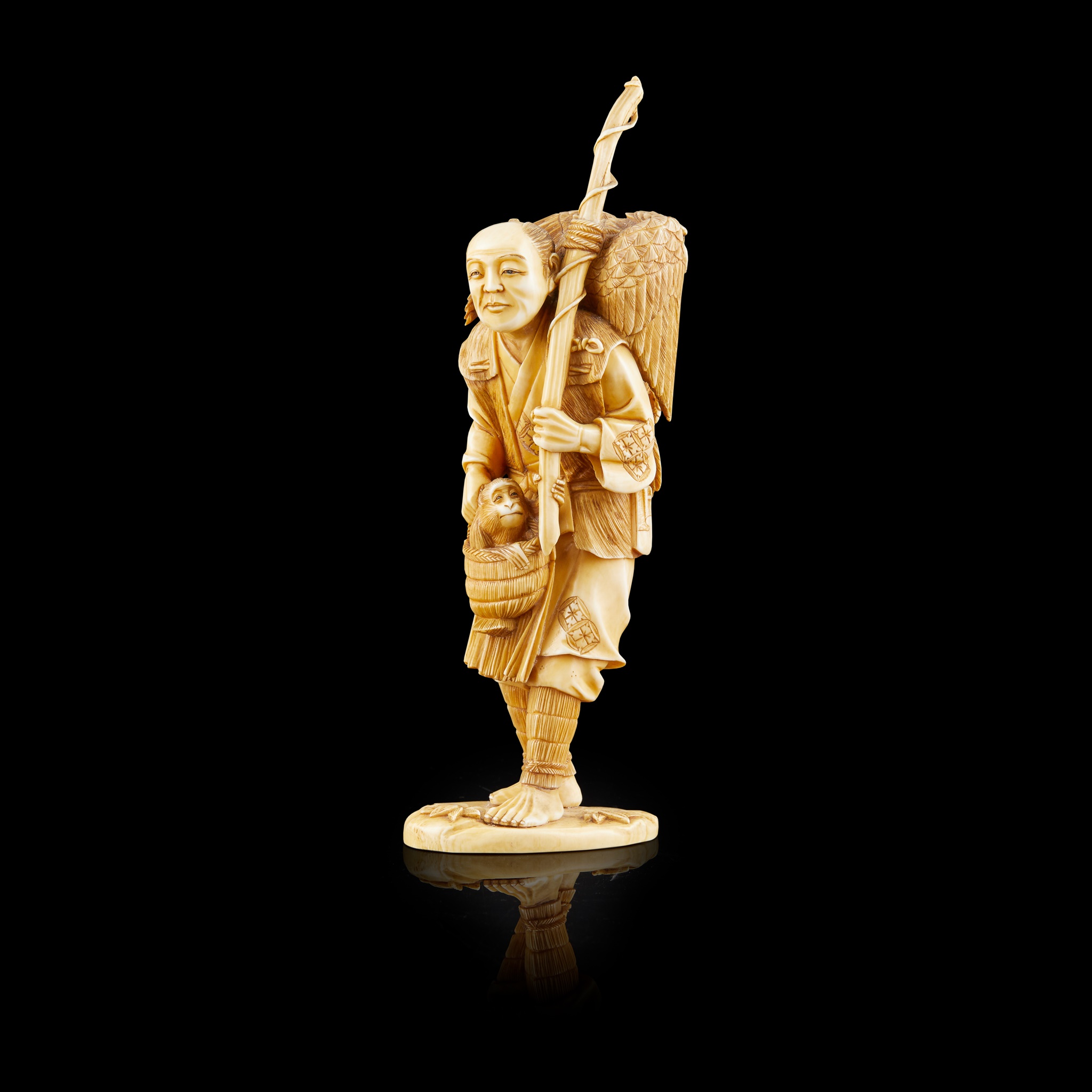 IVORY OKIMONO OF AN EAGLE HUNTER