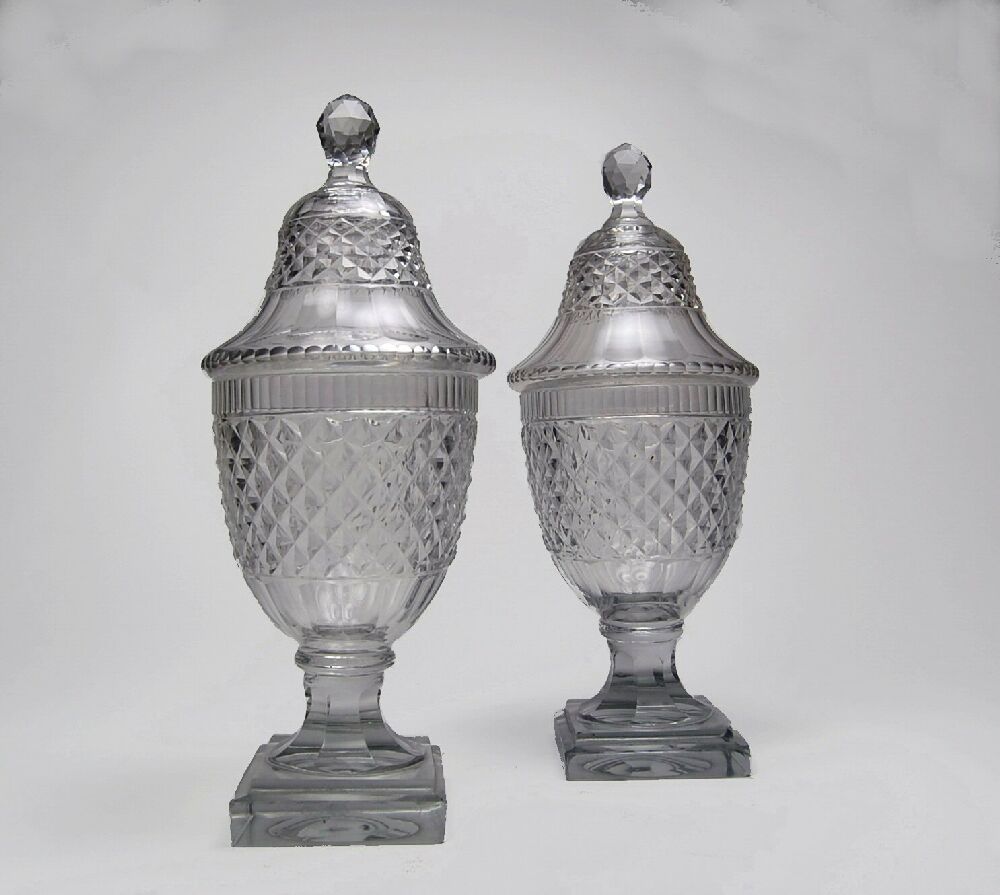 A pair of Regency cut glass sweetmeat jars and covers