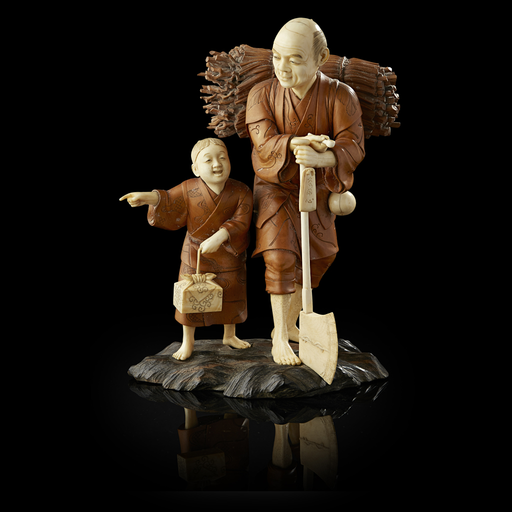 IVORY AND BURRWOOD OKIMONO OF A WOODCUTTER