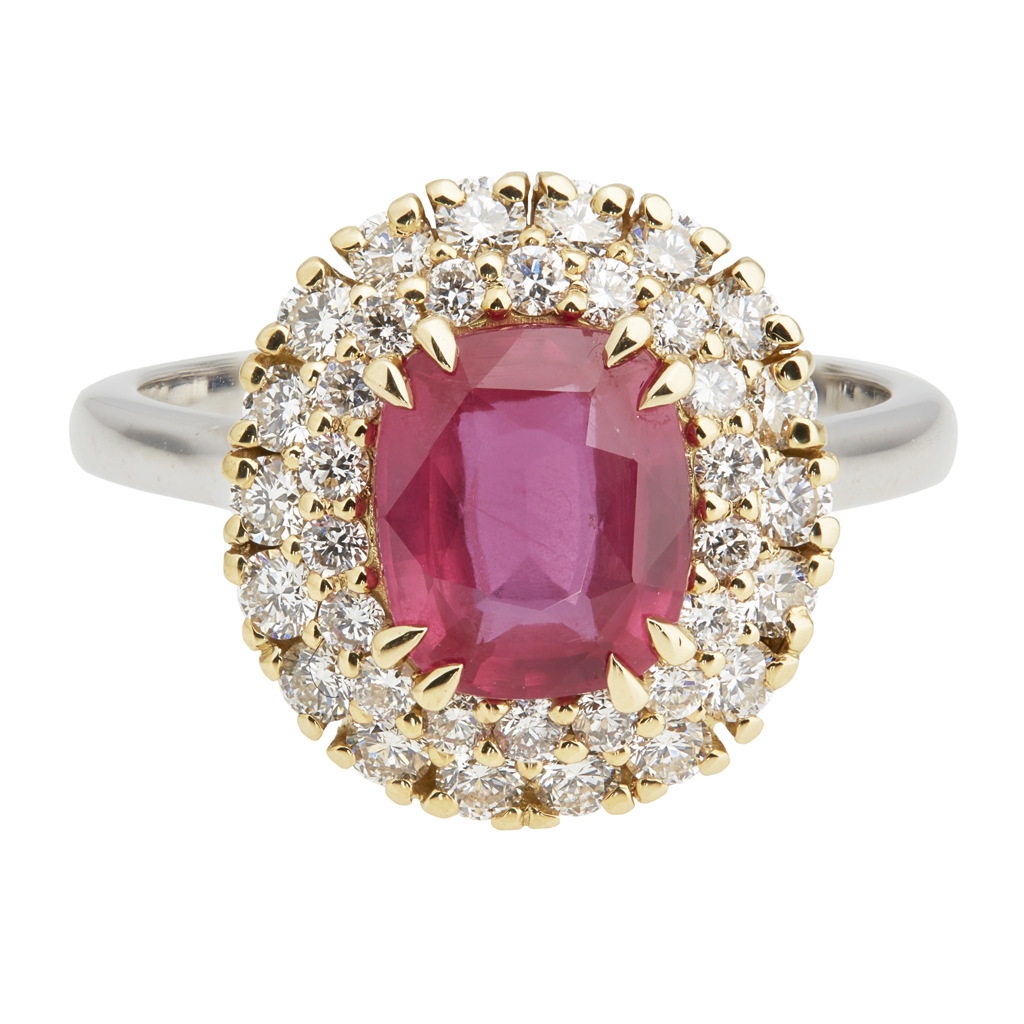 An 18k gold ruby and diamond set cluster ring