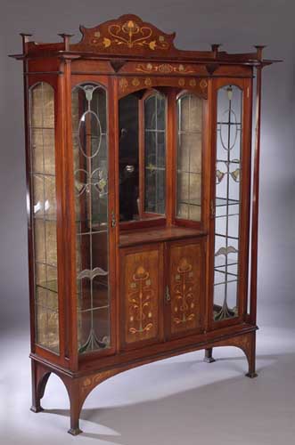 An Art Nouveau mahogany and inlaid display cabinet
