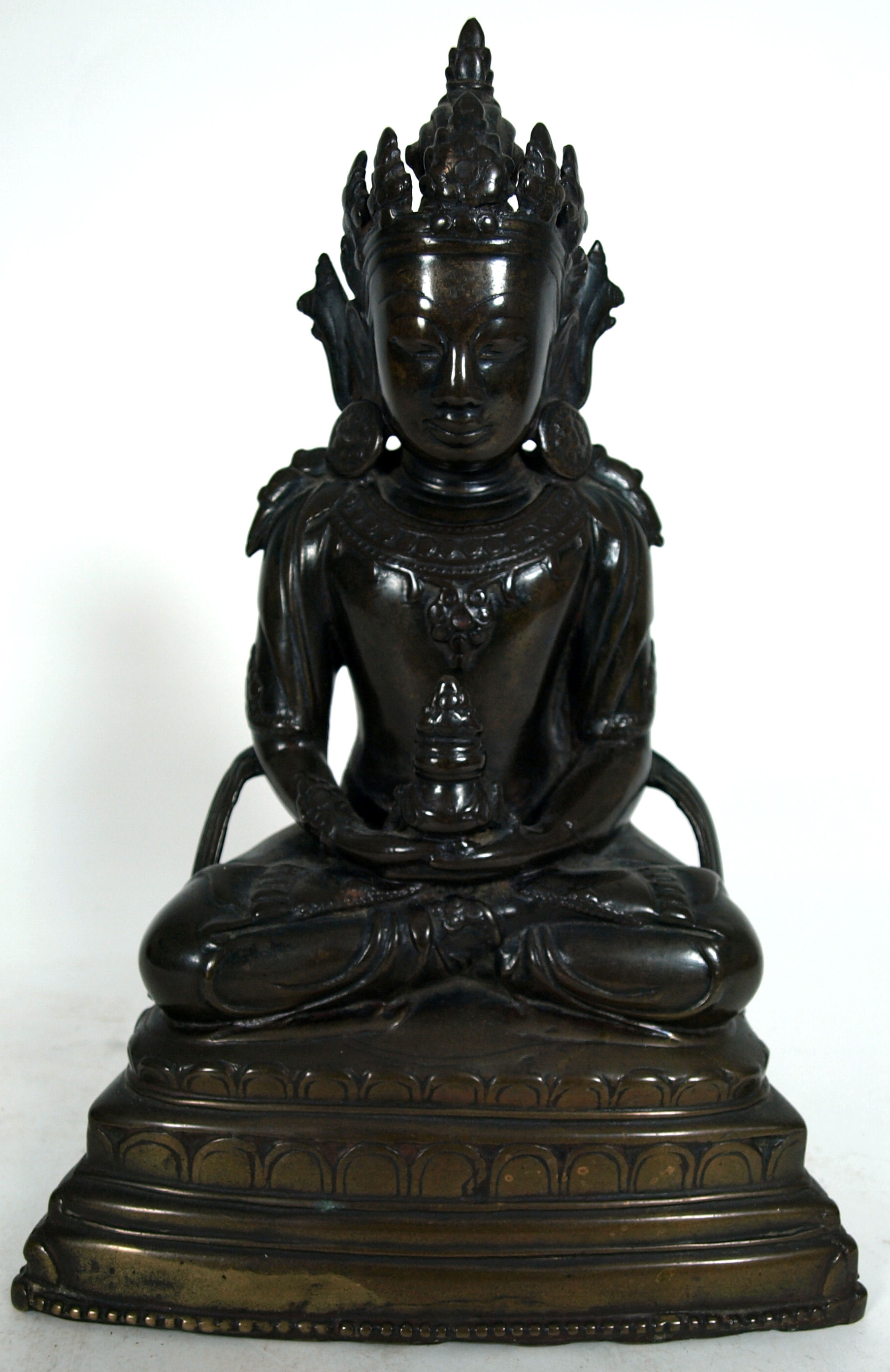 An 18th/19th century Tibetan bronze figure of Buddha Amitayus