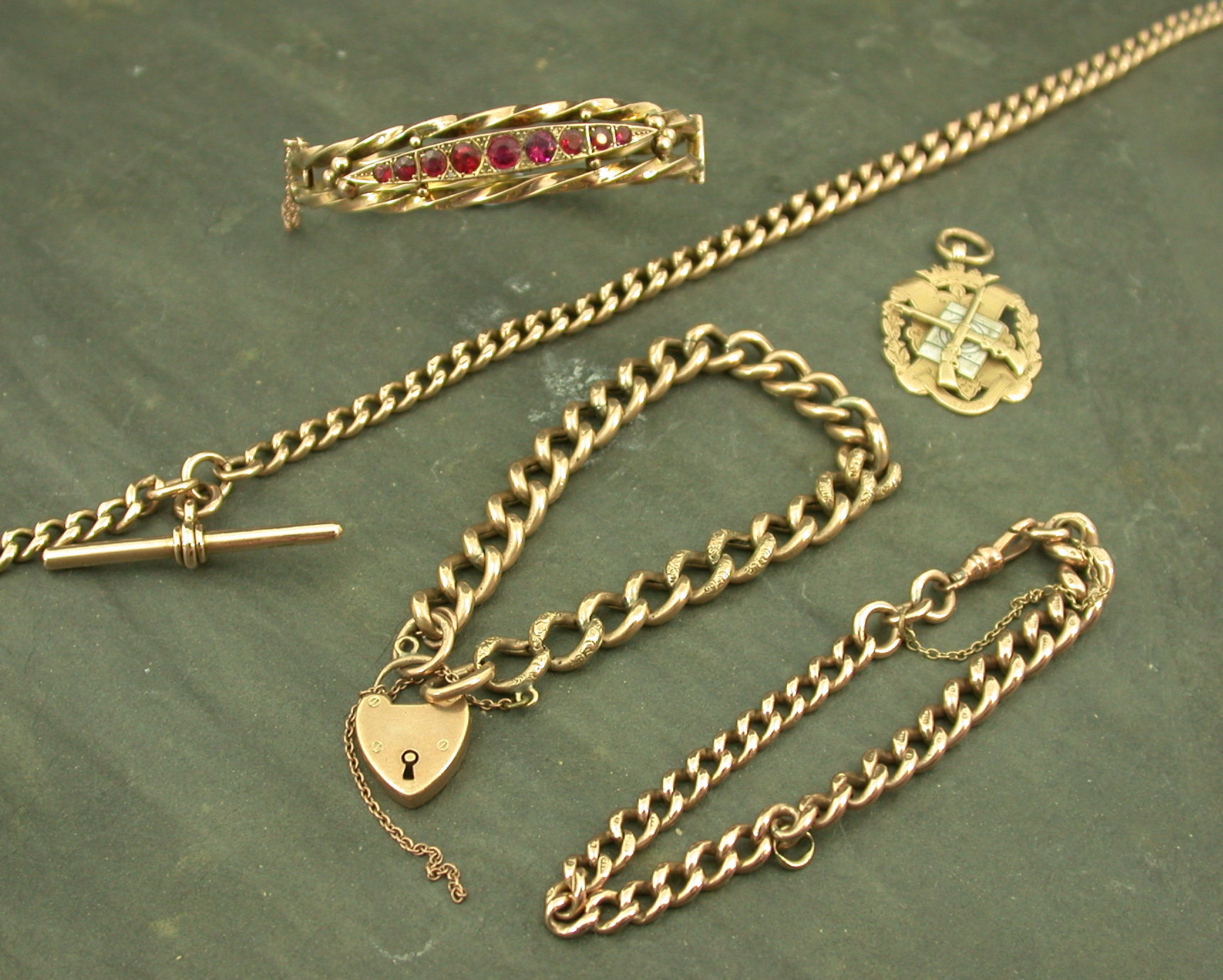 A 9ct gold graduated curb link Albert chain,