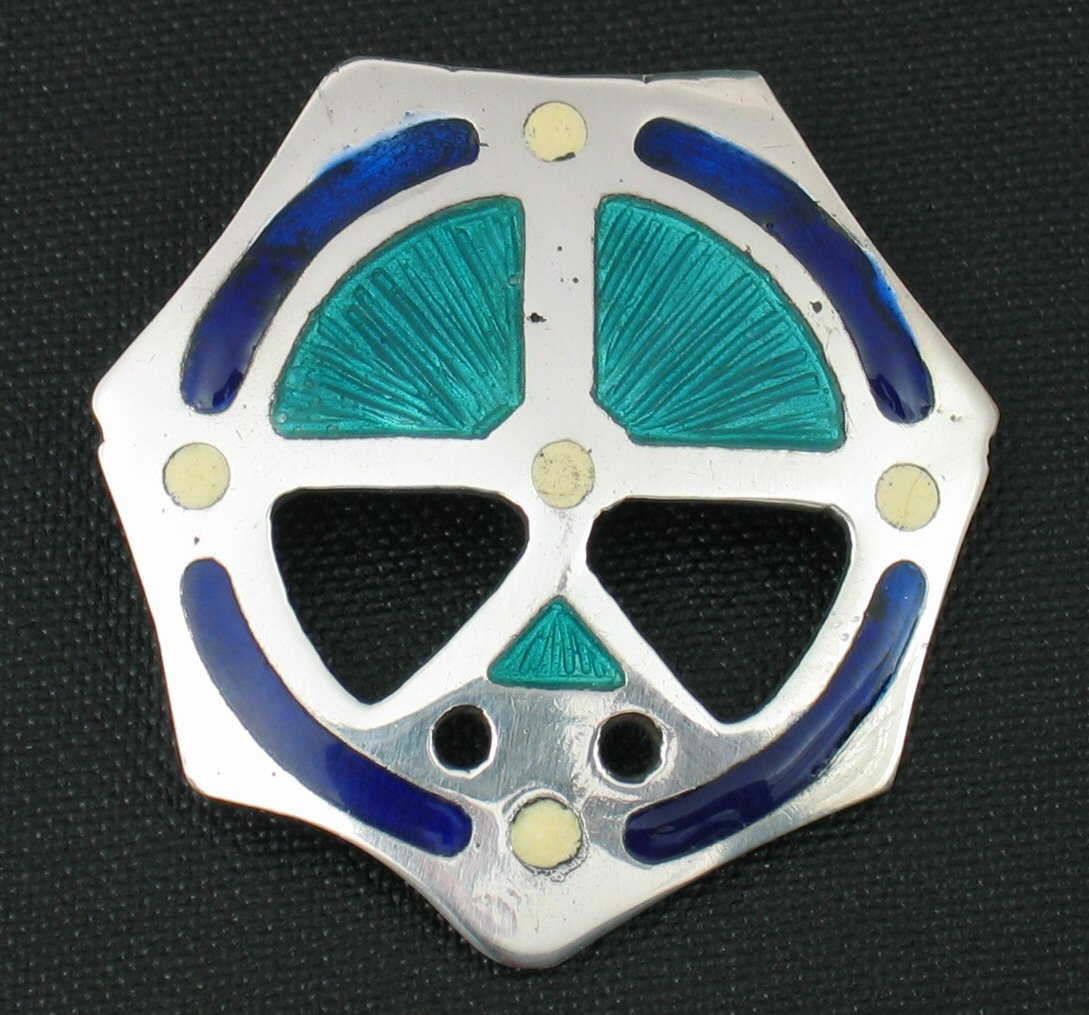 An Alexander Ritchie silver and enamelled brooch,