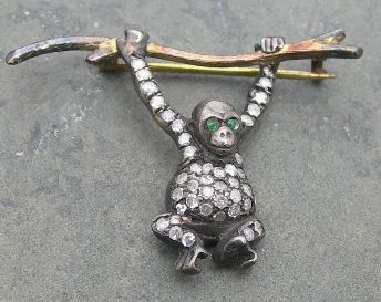 A novelty bar brooch